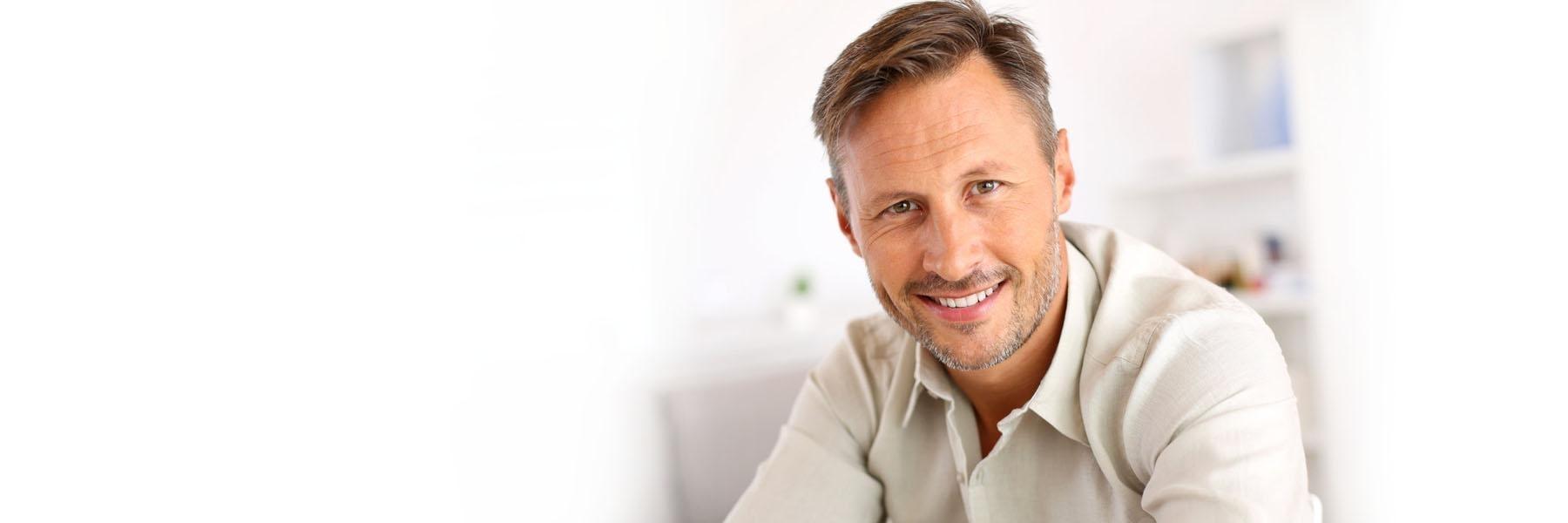 Man with facial hair smiling l dental crowns melbourne