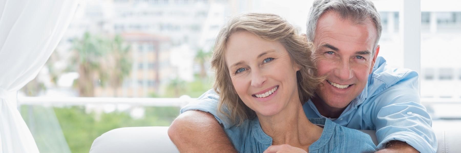 Two facial aesthetic patients smiling